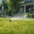 Watering garden with hose at heat summer. Close up. Automatic smart irrigation system.